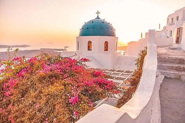Amazing view with white houses, sunset on the famous Greek dome resort flowes Greece, Europe. Traveling background. Artistic summer landscape vacation