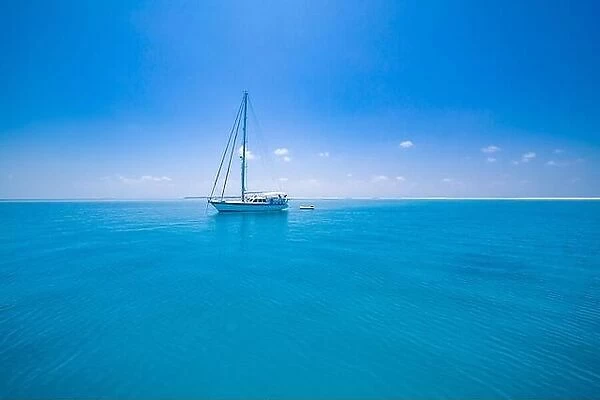 Beautiful bay with sailing boat. Summer recreational amazing view to yacht, swimming woman and clear water