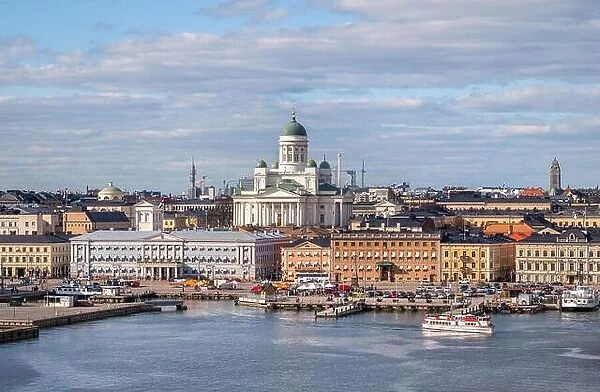 Helsinki, Finland - April 14 : Cathedral and other city buildings with central cityscape in Helsinki on April 14, 2019. With beautiful evening light