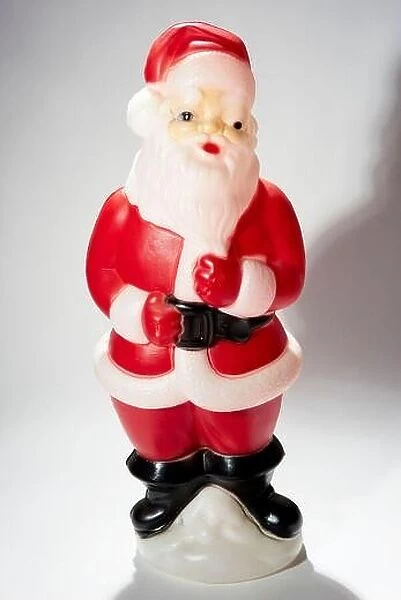 Plastic blow mold Santa figurine on white background