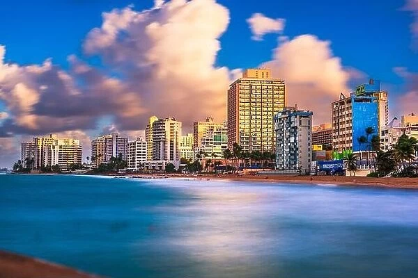 San Juan, Puerto Rico resort skyline on Condado Beach on dusk