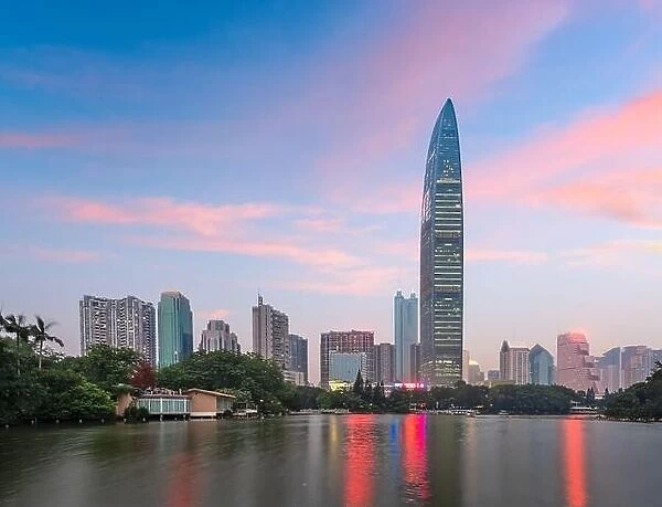 Shenzhen, China city park and skyline and at twilight