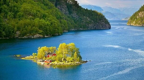 Small Island with a red cottage in Lovrafjord, Norway