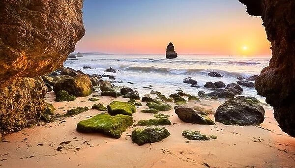 Sunrise at Algarve rocky beach near Lagos, Algarve, Portugal