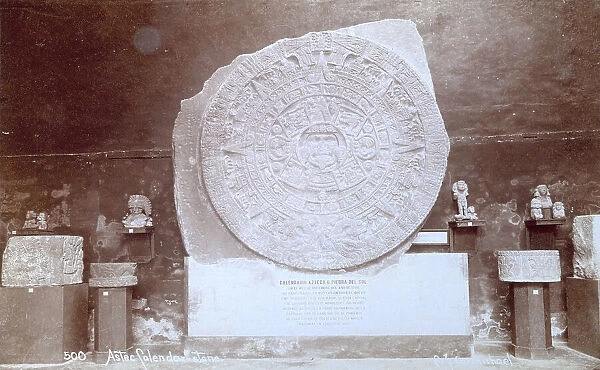 Aztec calendar or Sunstone surrounded by other finds of Aztec sculpture and architecture