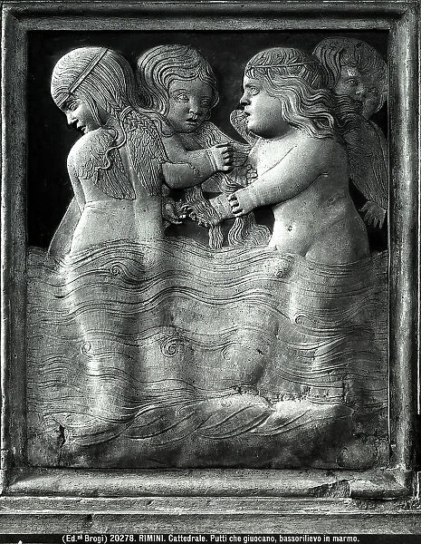 Bas relief with winged putti playing in the water. Work by Agostino di Duccio located in the Chapel of Children's Games in the Malatesta Temple, Rimini