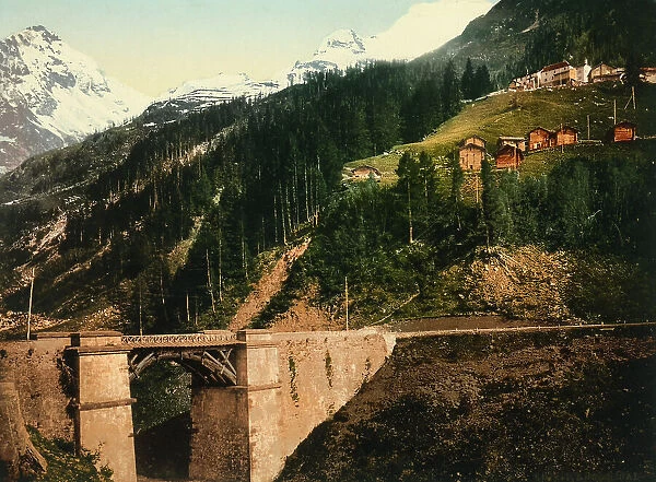 A bridge at the foot of a mountain on which rises the locality of Berisal, at the Sempione Pass in Switzerland