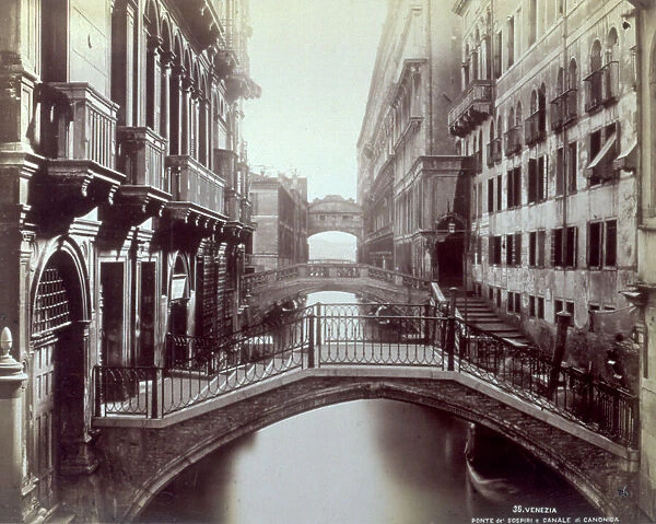 Canale di Canonica (or Rio di Palazzo) in Venice. View of a row of bridges which cross it. In the background the Bridge of Sighs