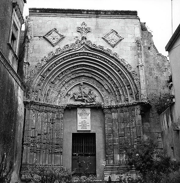 The Catalan gothic portal from the ruins of the Church of San Giorgio Vecchio in Ragusa. St. George killing the dragon is seen in the lunette