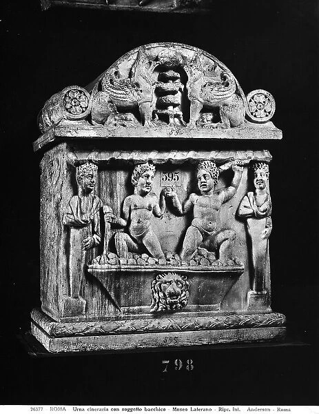 Cinerary Roman urn with a Bacchic scene depicting two men crushing grapes under a shelter; the work is preserved in the Vatican Museums, Vatican City