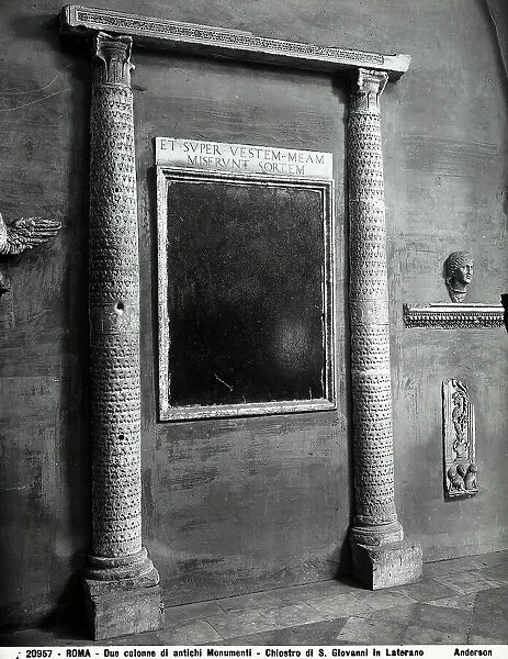 Columns and inscriptions found in Roman ruins, preserved along the walls in the cloister of the Basilica of S. Giovanni in Laterano, Rome