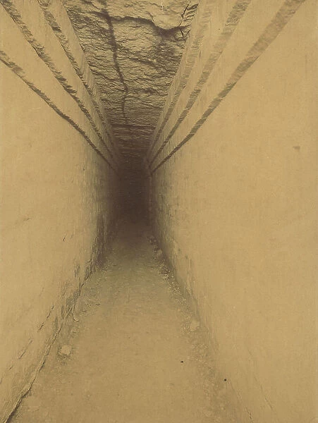 A corridor of the catacombs of Paris (ossuaire municipal), underground ossuary of the town of Paris in the galleries of an old quarry; relief with a view of the city and inscription 'Quartier de Kazerne'