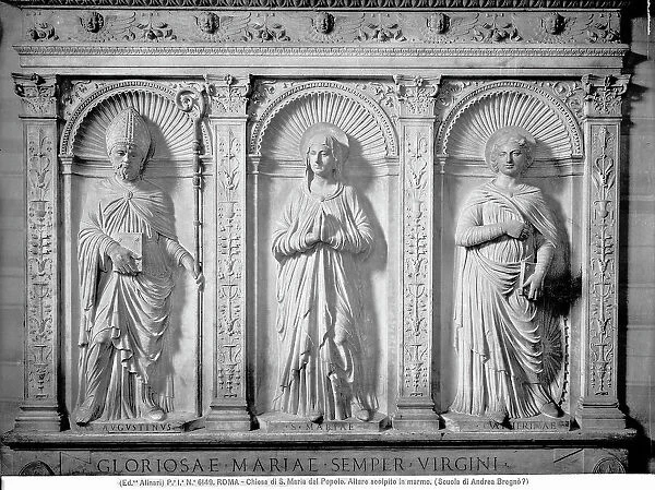 Three decorative figures on the marble altar at the Church of Santa Maria del Popolo in Rome