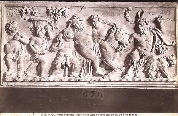 Drunken Silenus led, on a donkey, by the God Pan. Relief originally found in Pompeii, now kept a the National Archaeological Museum in Naples