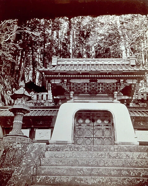 The facade of a Japanese temple. In the foreground the entrance stairs