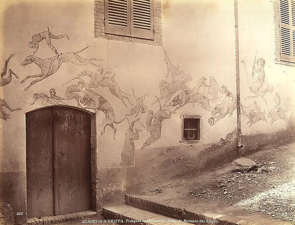 Fresco with the title Desjardins, by Gorges de la Chiffa. The fresco shows a hunting with men and animals, depicted in satirical terms. The mural is collocated on the walls of Ruisseau des Singes Hotel