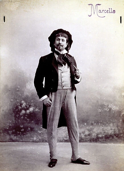 Full-length portrait of a young man in the part of the painter Marcello, in la Boheme, opera by Giacomo Puccini. He is standing, with a pipe in his hand, and wearing a dark velvet beret and a bow at his neck