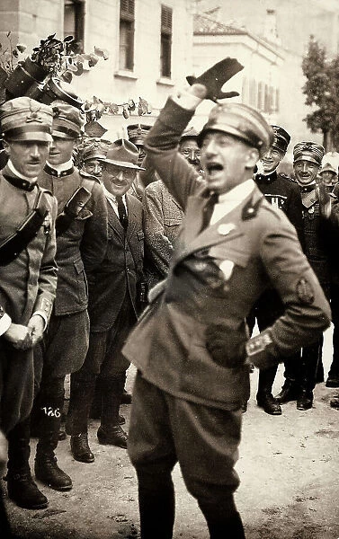 Gabriele D'Annunzio makes a satisfaction gesture. The photograph was taken during the occupation of city by part of the Italian legionary troops, headed by the poet