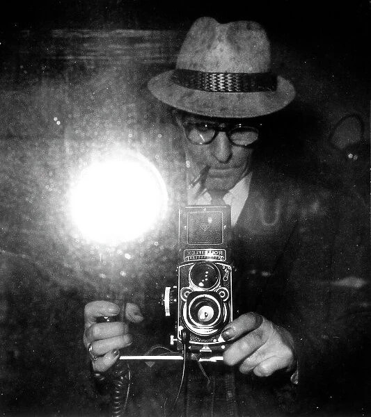 Giuseppe Borra takes a picture of himself with a Rolleiflex, in front of a mirror