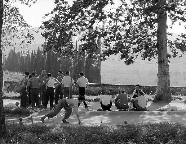 A group of men during a game of bowls