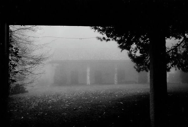 House in fog in Livigno, Sondrio