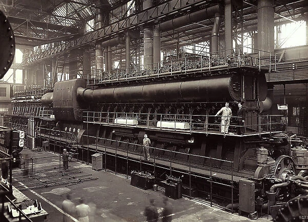 The image shows the first engine DL6512, designed by Fiat Grandi Motori of Turin. In the foreground, some workers are at work