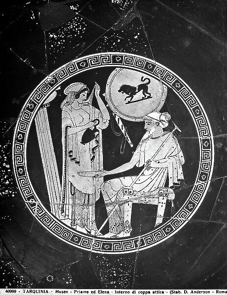 Interior of an Attic red-figure kylix by the painter Douris, depicting Helen pouring liquid into a plate held by King Priam, in the National Museum of Tarquinia, in Tarquinia