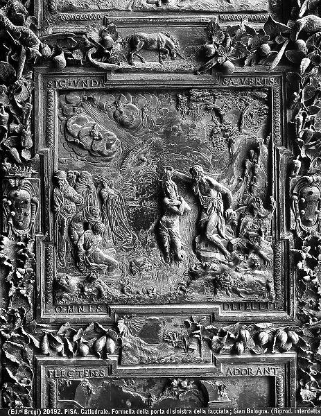 Jesus Christ's Baptism, sculpture work from Giambologna's school, collocated in the left portal panel of the Cathedral of Pisa