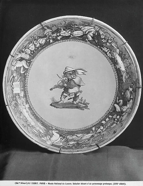 Large salad bowl with grotesque figure preserved in the Louvre Museum, Paris
