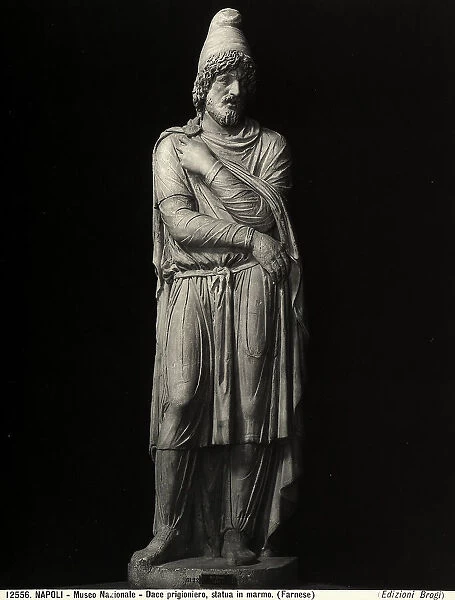 Marble statue of the prisoner Dace, taken from the Trajan's Forum, work preserved in the National Archaeological Museum of Naples. The man is represented in the national costume composed of a long tunic with tight sleeves, closed shoes and a Phrygian cap