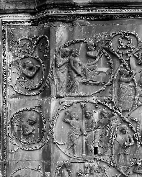 The three Maries at the Sepulcher and the Flagellation. Detail of the bas-relief with the Evangelical Stories, by Lorenzo Maitani in the third pillar of the facade of the cathedral of the Assunta in Orvieto