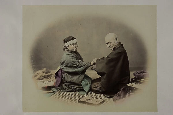 Old japanese doctor and young patient during a visit. They are both in traditional clothes and are kneeling in front of each other. In the foreground small drawers full of medicines