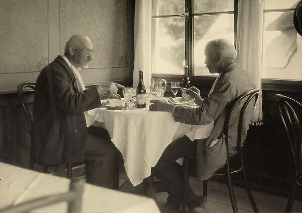 The photographer Mario Gabinio (at right) dining in a Hotel in Trafoi