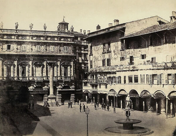 Piazza della Erbe, Verona, delimited by the picturesque 'Houses of Mazzanti', adorned with pictorial decorations from the sixteenth century In the background, the seventeenth century Palazzo Maffei and the Column of San Marco are visible