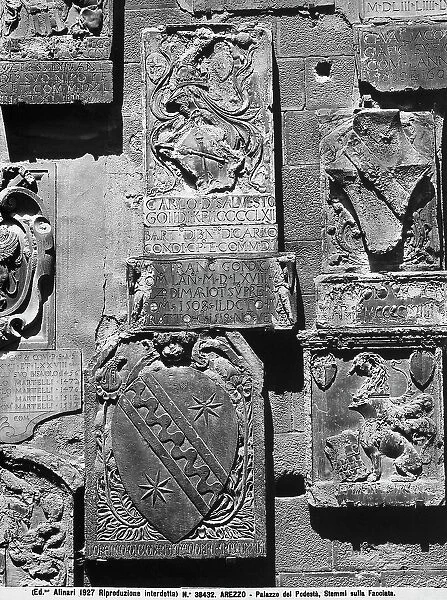 Podesta coat of arms in stone, on the faade of Palazzo Pretorio in Arezzo