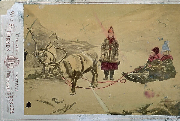 Polar landscape with two lapps on a sled drawn by reindeer. A third lapp is standing. They are dressed in characteristic clothing