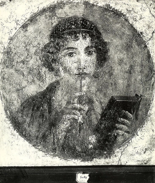 Portrait of a poetess wall painting exhibited at the National Archaeological Museum in Naples