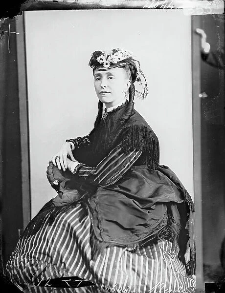 Portrait of woman sitting, in nineteenth century costume
