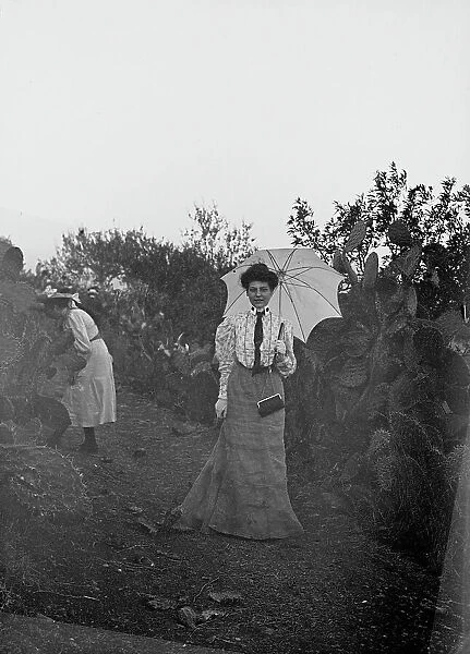 Portrait of woman with umbrella near Ragusa