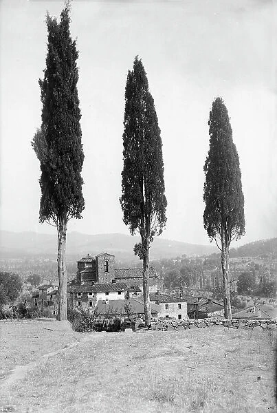 Romanesque churches and cypresses in the countryside of Badia a Ruoti