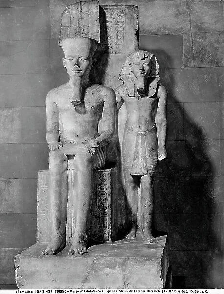 Statue of the god Amon seated with the Pharaoh Tutankhamon (Tutankhamun, Tutankhamen), in the Museo Egizio, Turin