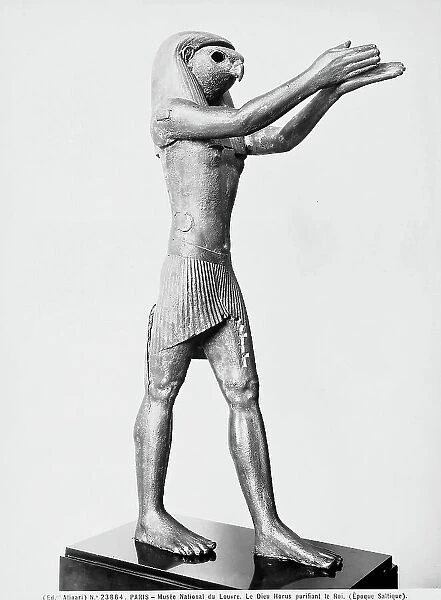 Statue of the god Horus during an act of purification: in the Louvre Museum, Paris