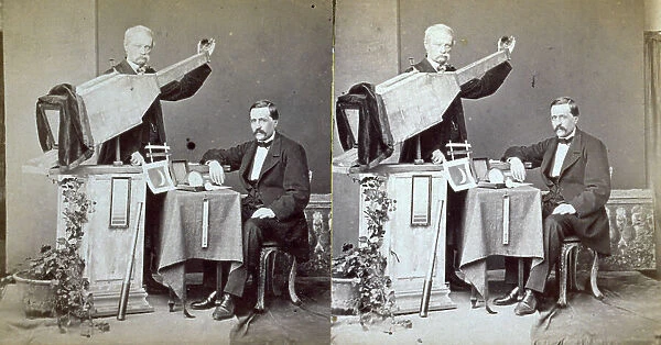 Studio portrait of two astronomers with scientific and photographic instruments