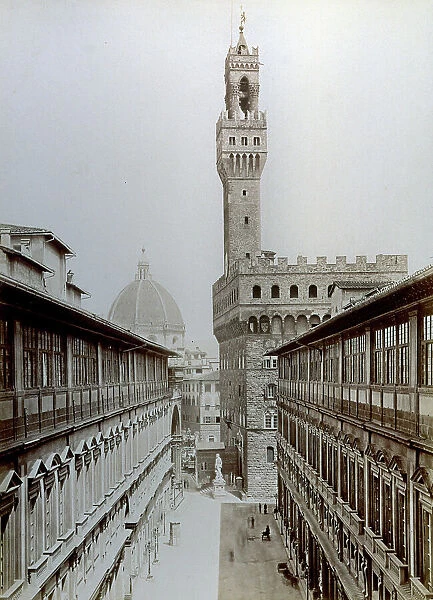 The Uffizi square in Florence from the inside of the Gallery. In the foreground the two wings of the Museum, the view closed by Palazzo Vecchio. In the background the dome of the Cathedral