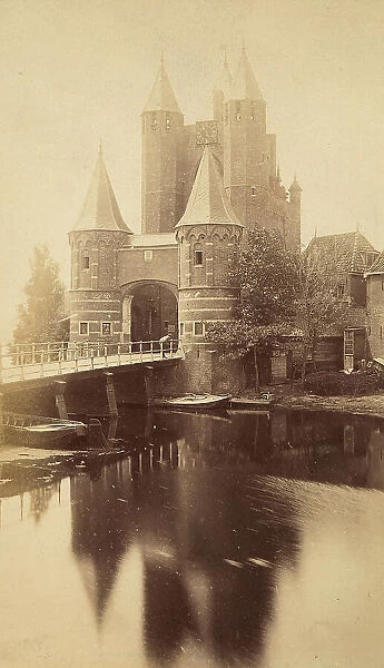 View of the Amsterdamse Poort, in Harlem, the Netherlands. Remains of the ancient walls of the XIV century. It is constituted by a massive turret mast with two lateral octagonal turrets