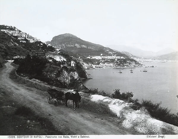 View of the Gulf of Salerno with Raito, Vietri and Salerno. In the foreground, a man with a horse and carriage, on the road that runs along the sea