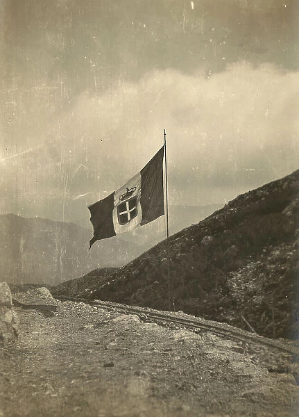 World War I: the flag of the Kingdom of Italy waving on the mountain Krasji