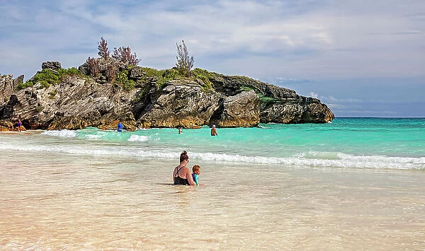 Bermuda, Southampton, Horseshoe Bay beach, family enjoying pink sand and aquamarine water