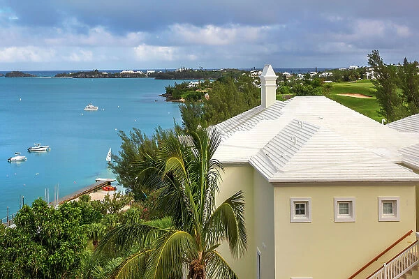 Bermuda, view of Castle Harbor waterfront with cerulean ocean and iconic white rooftop
