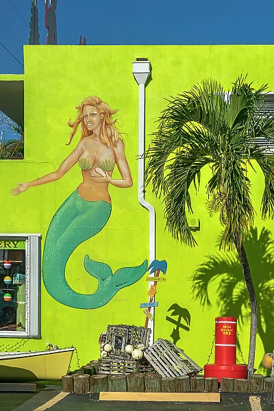 Florida, The Keys, Islamorada, mermaid mural near palm tree